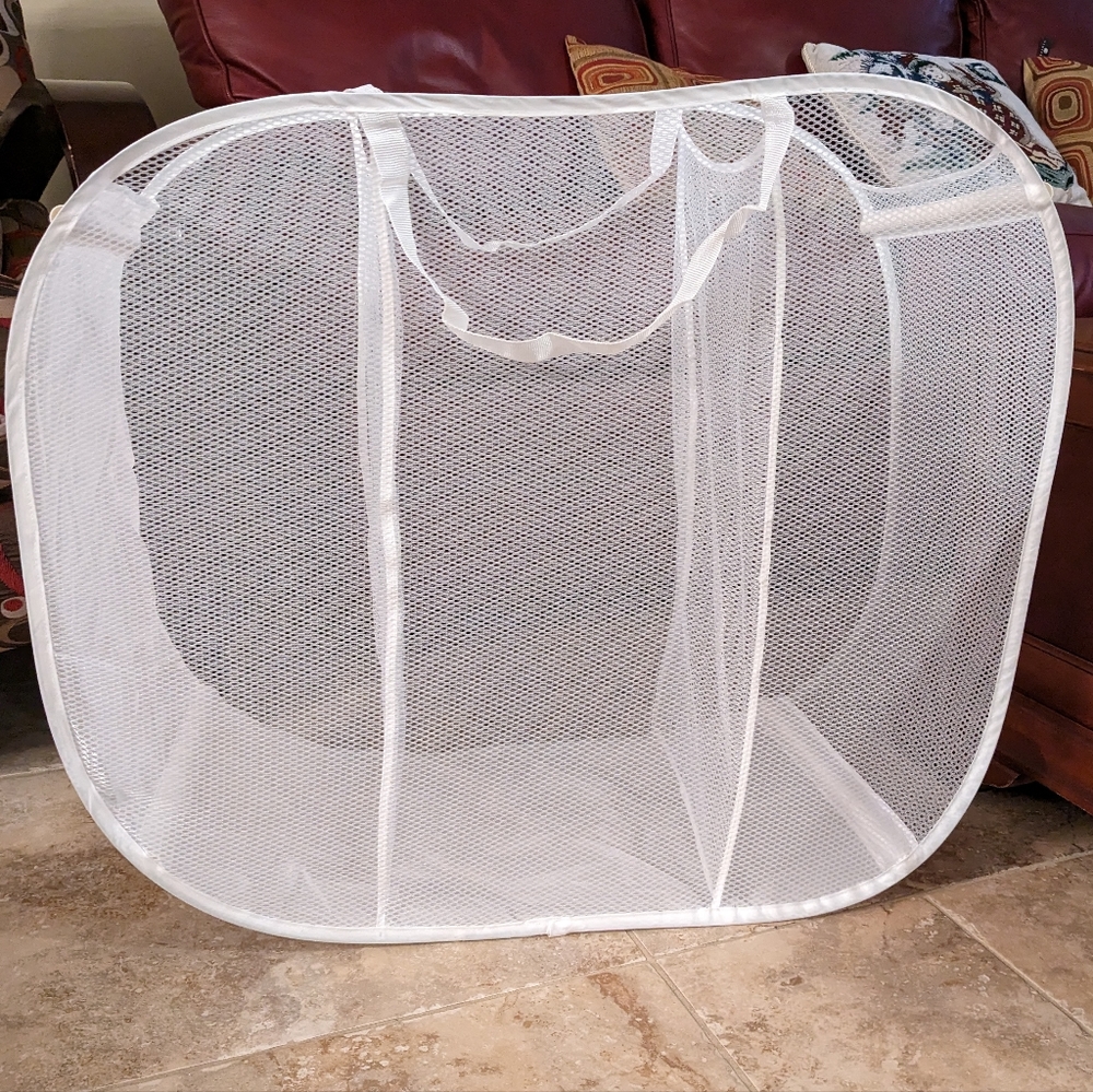 2 white mesh hampers